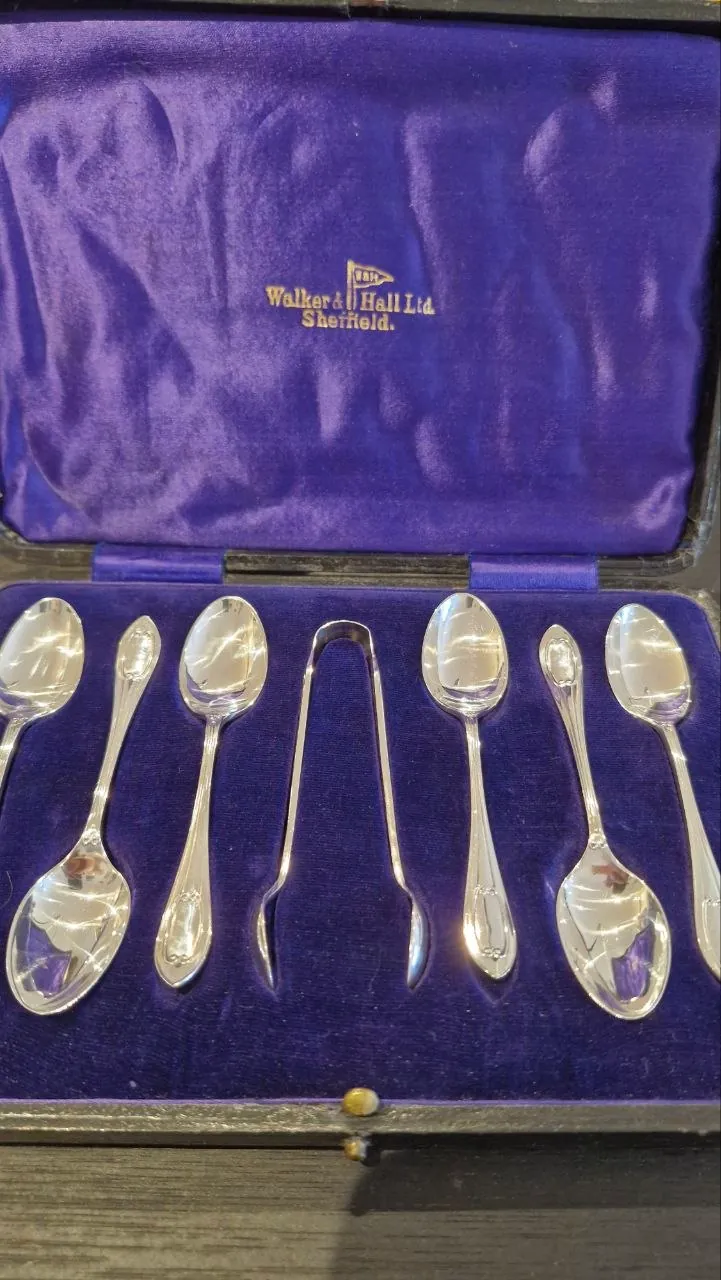The complete Walker & Hall Sheffield teaspoon and sugar tong set, fully restored in its velvet case